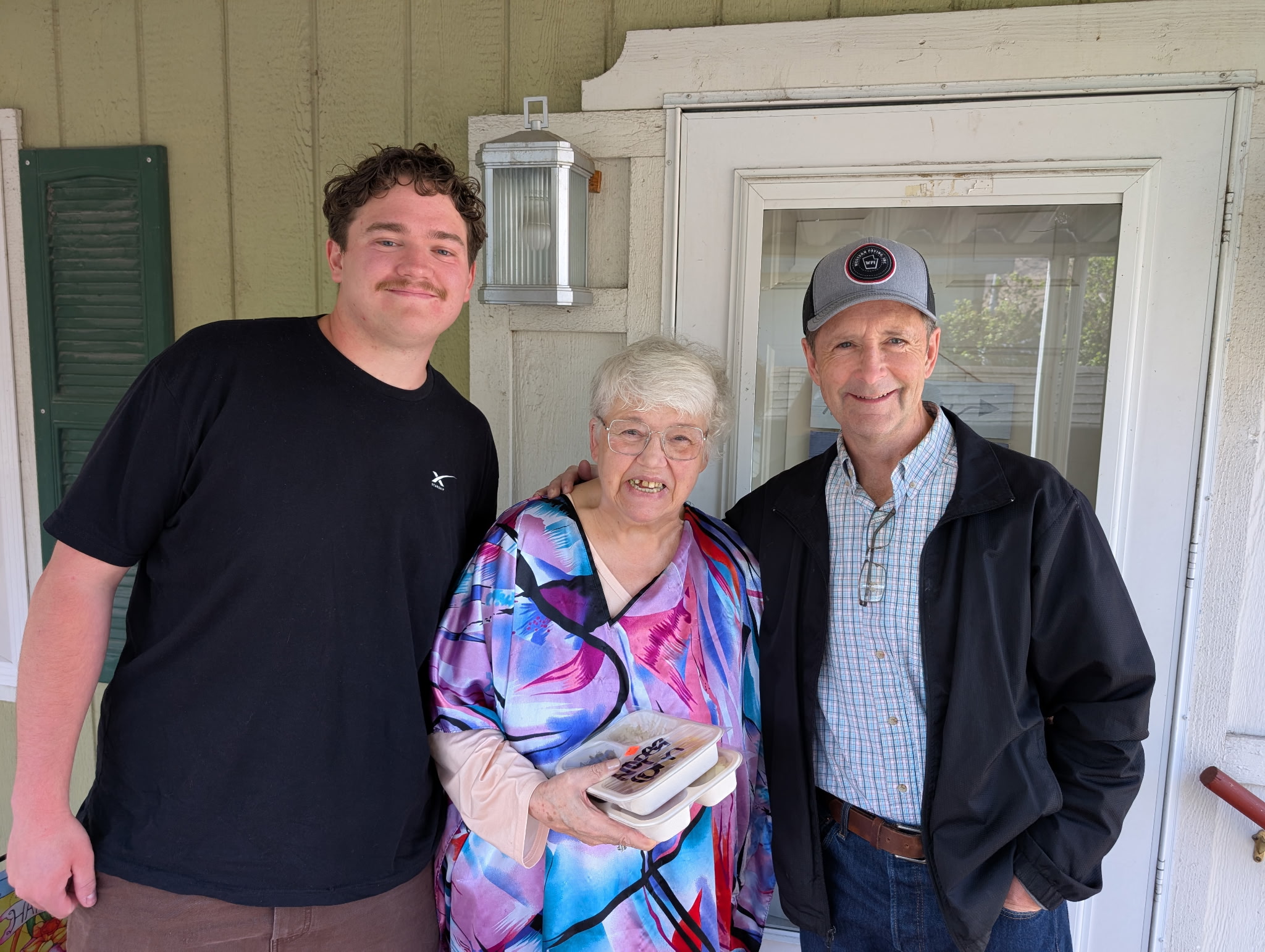 Springville Mayor Matt Packard (right) visits with a senior resident during a Meals on Wheels delivery on Tuesday, March 24.