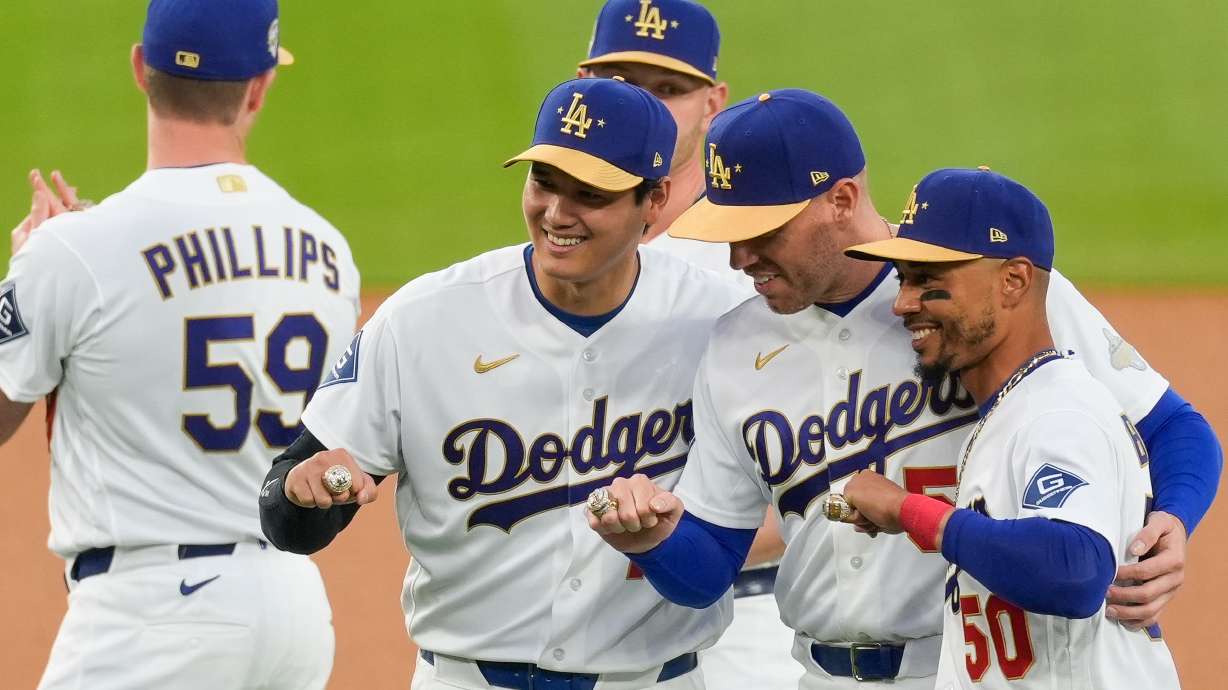 Los Angeles Dodgers Shohei Ohtani, Freddie Freeman and Mookie Betts pose with their rings during a World Series Champion ring ceremony prior to a baseball game against the Arizona Diamondbacks in Los Angeles, Friday, March 27, 2026.