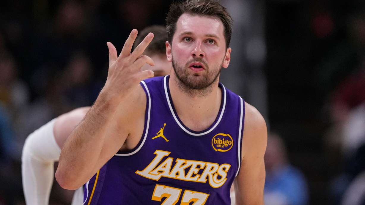 Los Angeles Lakers guard Luka Doncic (77) gestures after a three-point basket against the Indiana Pacers during the first half of an NBA basketball game in Indianapolis, Wednesday, March 25, 2026.