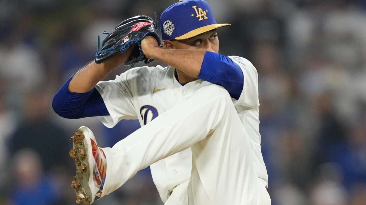 Los Angeles Dodgers relief pitcher Edwin Diaz throws to the plate during the ninth inning of a baseball game against the Arizona Diamondbacks, Friday, March 27, 2026, in Los Angeles.