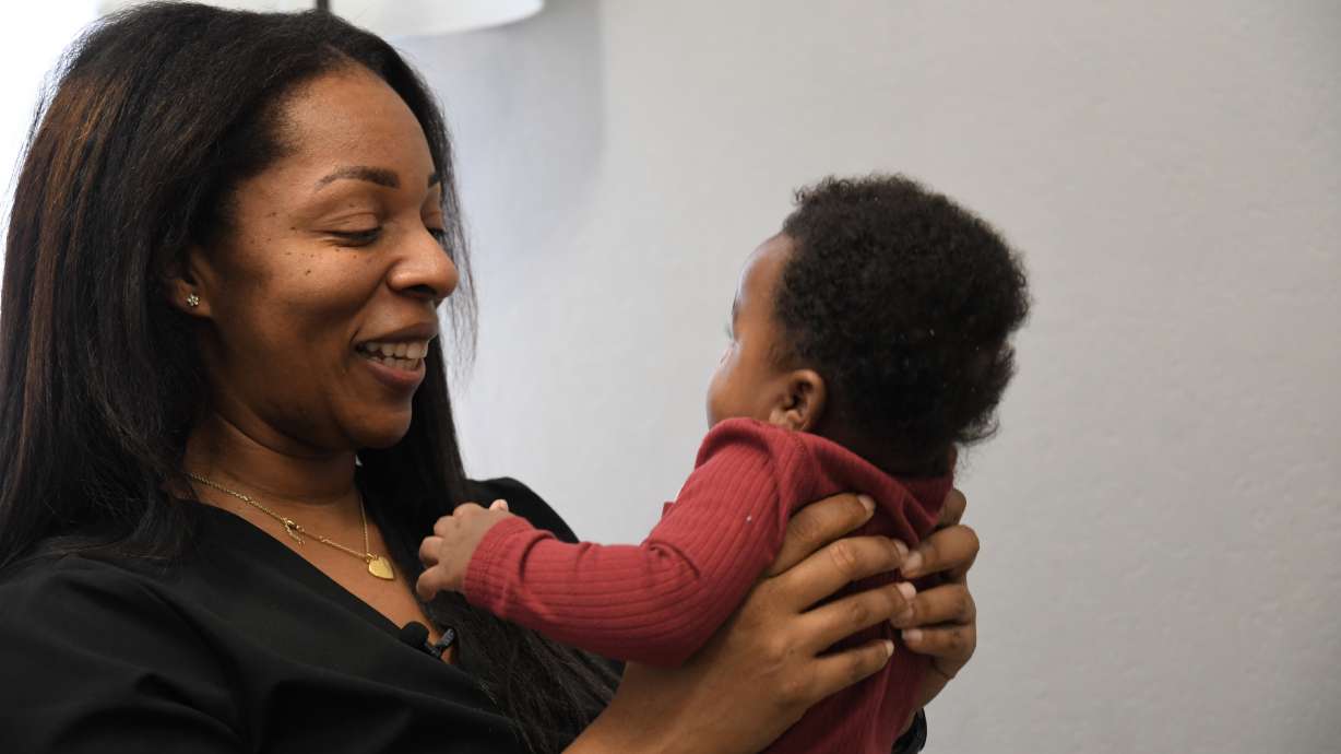 Shanille Bowens, a doula, smiles at Isaiah Stewart during an appointment on Feb. 28, in Memphis, Tenn.
