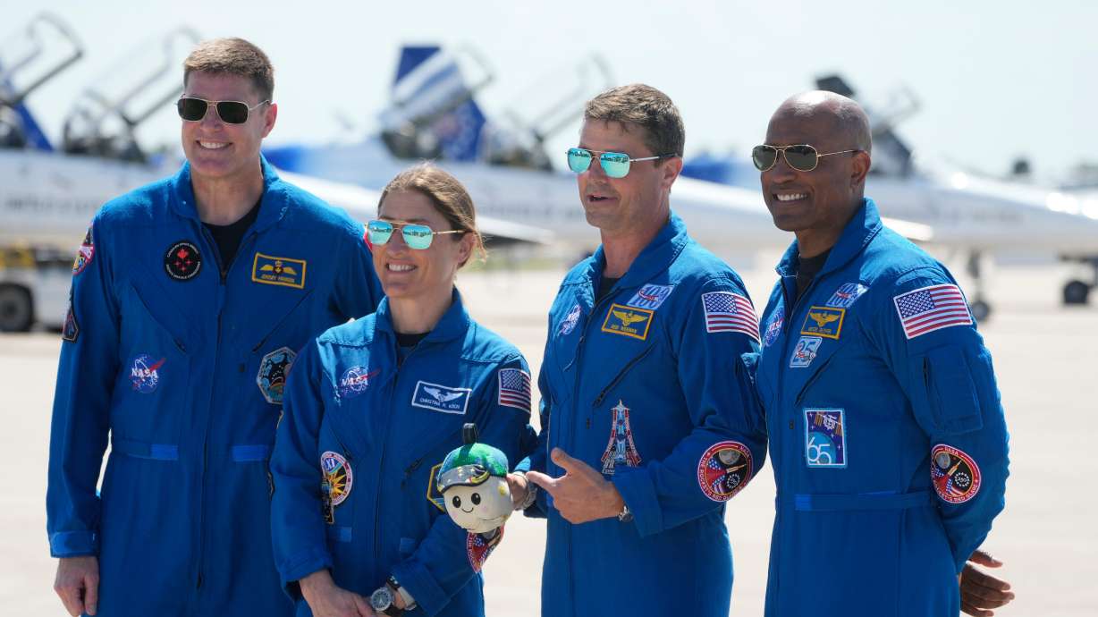 Artemis 2 crew members, from left, Mission Spc. Jeremy Hansen, of Canada, Mission Spc. Christina Koch, Commander Reid Wiseman, and Pilot Victor Glover pose for a photo after the crew's arrival at the Kennedy Space Center Friday in Cape Canaveral, Fla.