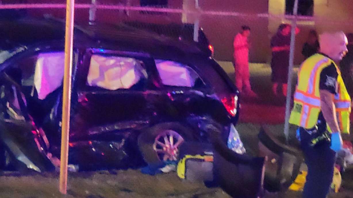 An 11-year-old child was killed and seven others were injured after a stolen vehicle fleeing police crashed into a car carrying a family Friday night, authorities said.