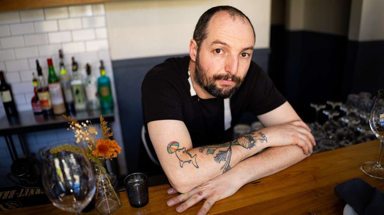 Andrew Fuller, co-owner and chef at Oquirrh Restaurant, poses in Salt Lake City on March 19. The former snowboarder is becoming a chef to watch in the kitchen.