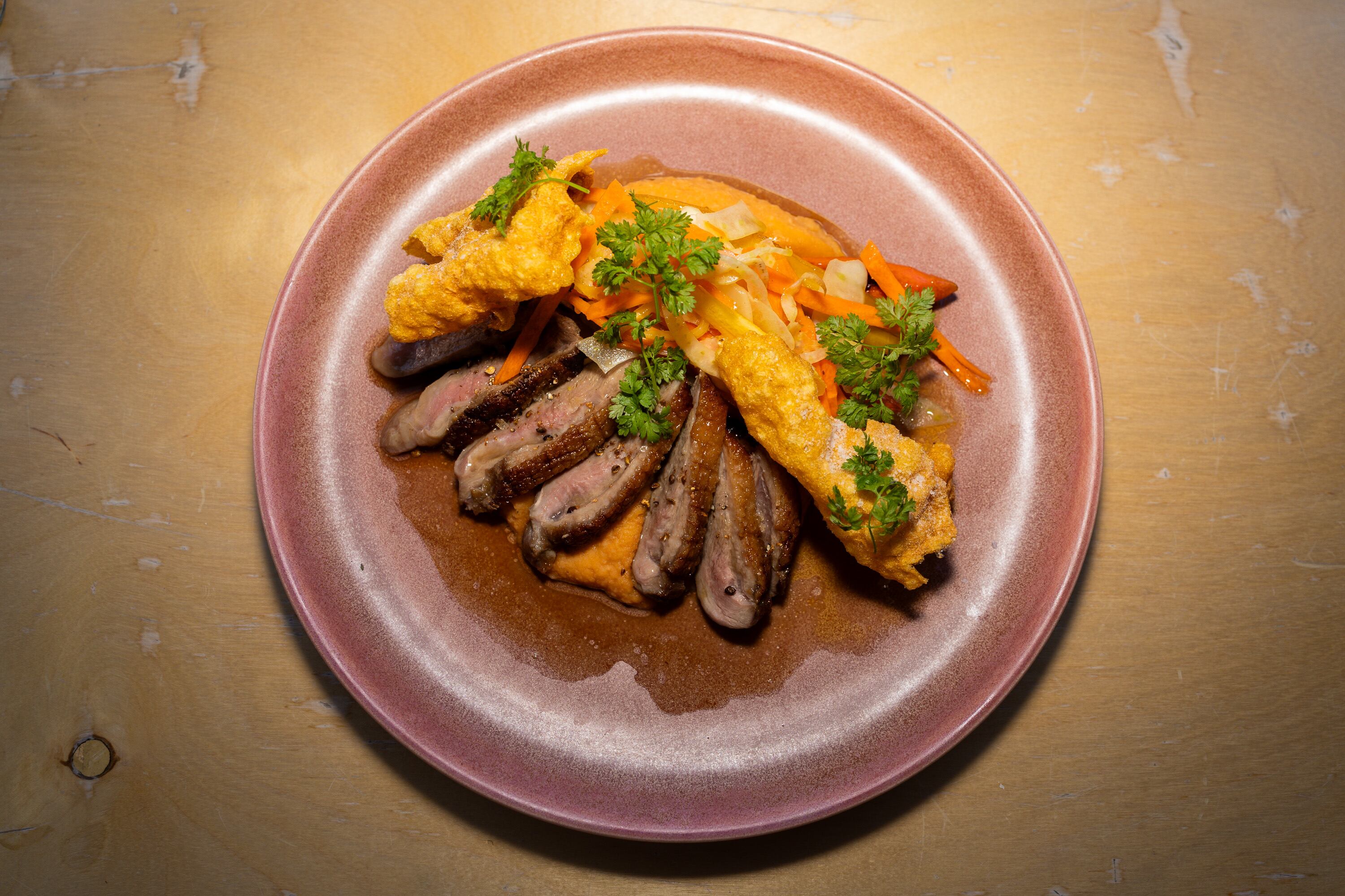 The roasted duck breast at Oquirrh Restaurant in Salt Lake City on March 19. Owner Andrew Fuller said he remembered being fascinated with the cooks in the kitchen when he began bussing tables at age 15.