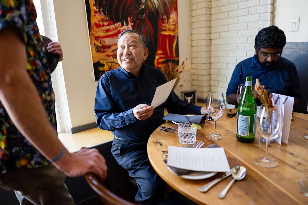 Toto Olivera orders food at Oquirrh Restaurant in Salt Lake City on March 19. Owner Andrew Fuller's wife, Angie, is in charge of the hospitality side of the restaurant.