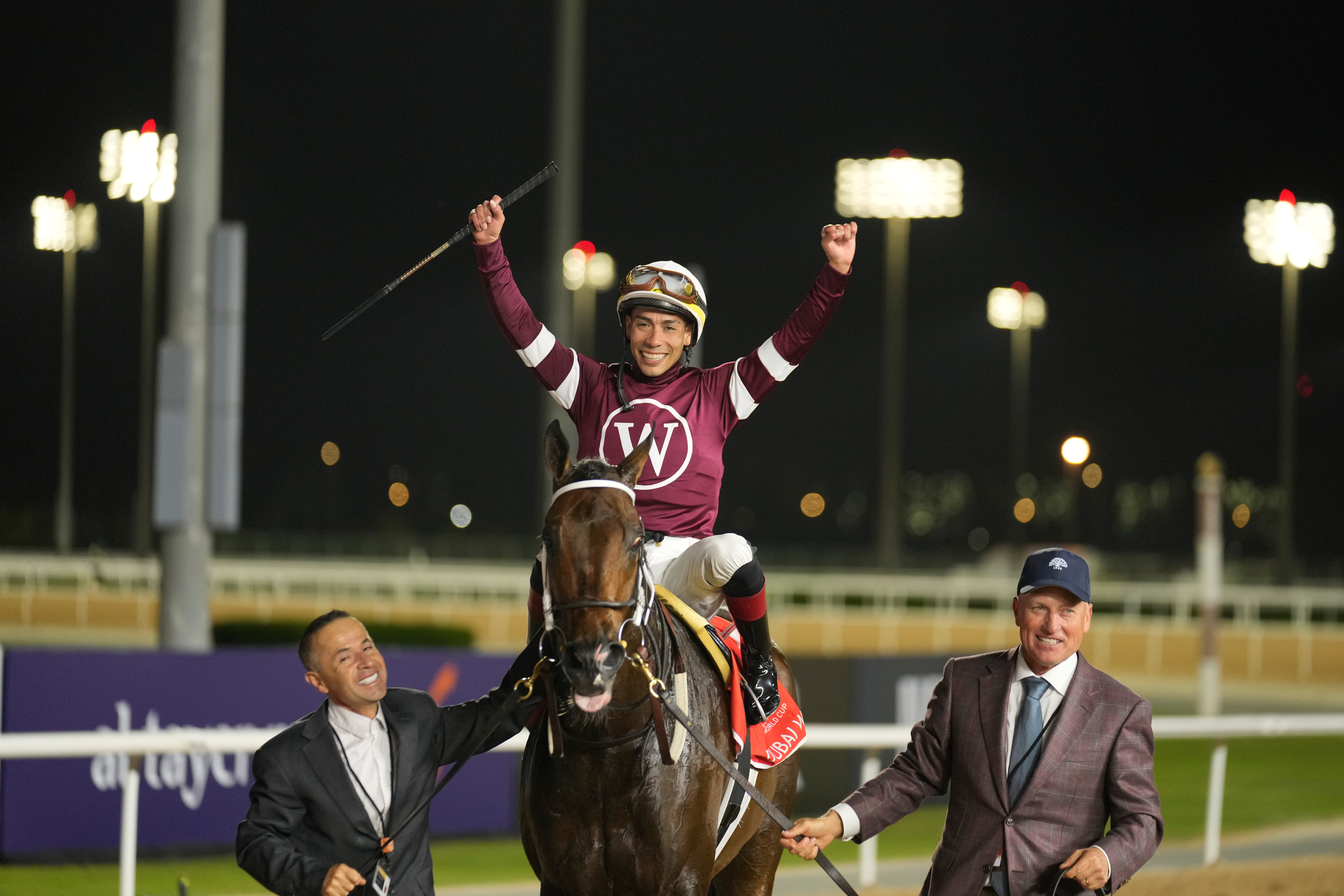 Jockey Jose Ortiz, aboard Magnitude, celebrates winning the $12 million Dubai World Cup horse race over 2000m (10 furlongs) at Meydan Racecourse in Dubai, the United Arab Emirates, Saturday, March 28, 2026. 