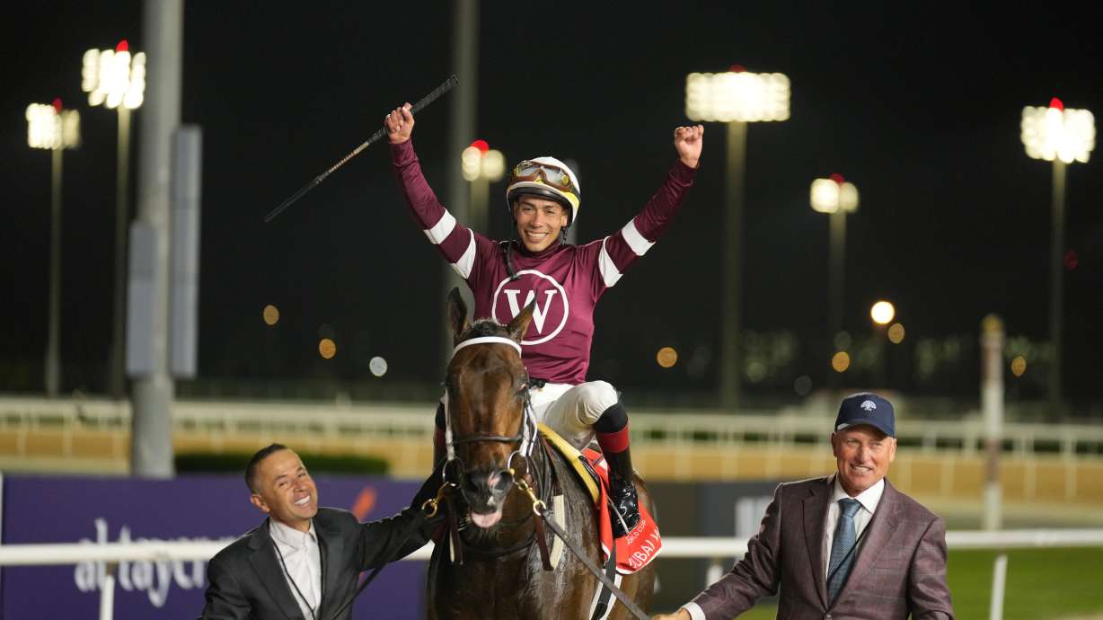 Jockey Jose Ortiz, aboard Magnitude, celebrates winning the $12 million Dubai World Cup horse race over 2000m (10 furlongs) at Meydan Racecourse in Dubai, the United Arab Emirates, Saturday, March 28, 2026.