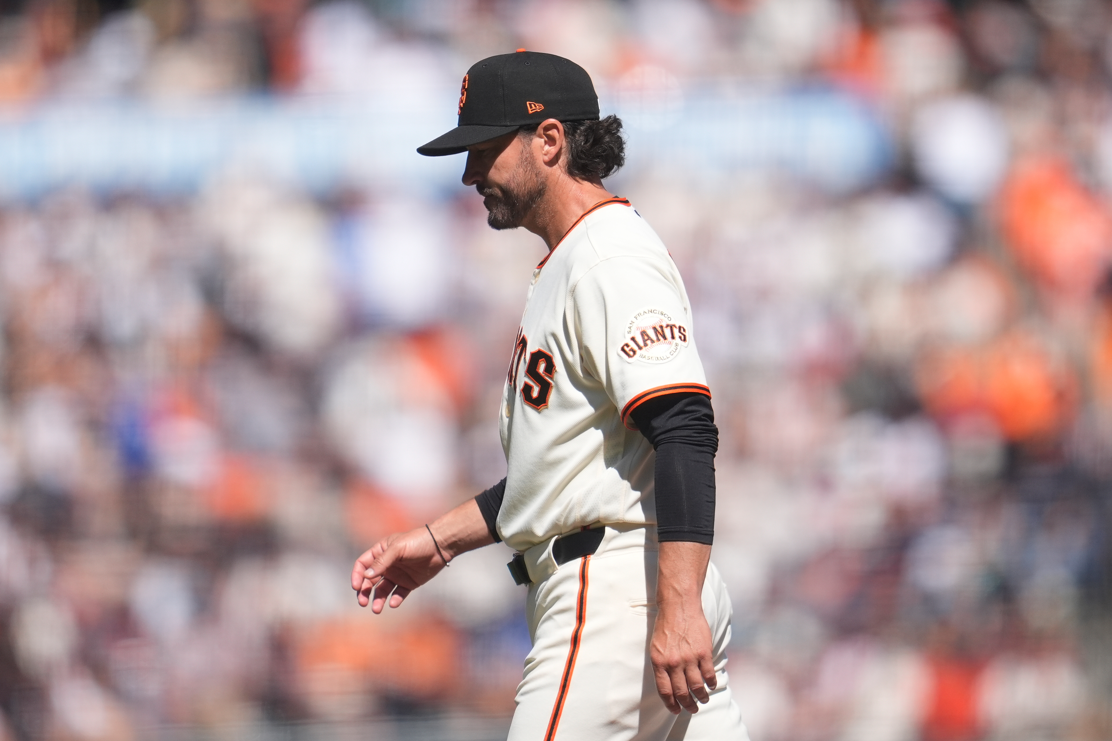 San Francisco Giants manager Tony Vitello walks to the dugout after making a pitching change during the sixth inning of a baseball game against the New York Yankees in San Francisco, Friday, March 27, 2026.