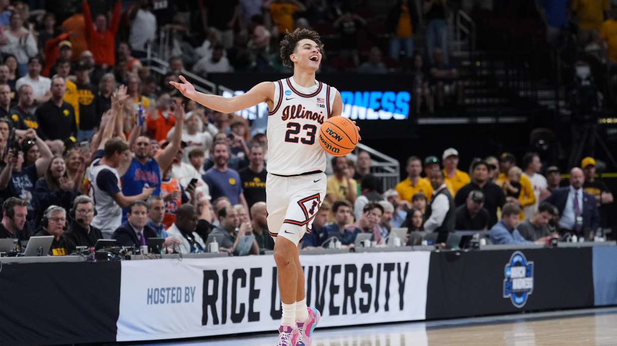 Illinois' Keaton Wagler celebrates after Illinois beat Iowa in an Elite Eight game in the NCAA college basketball tournament Saturday, March 28, 2026, in Houston.