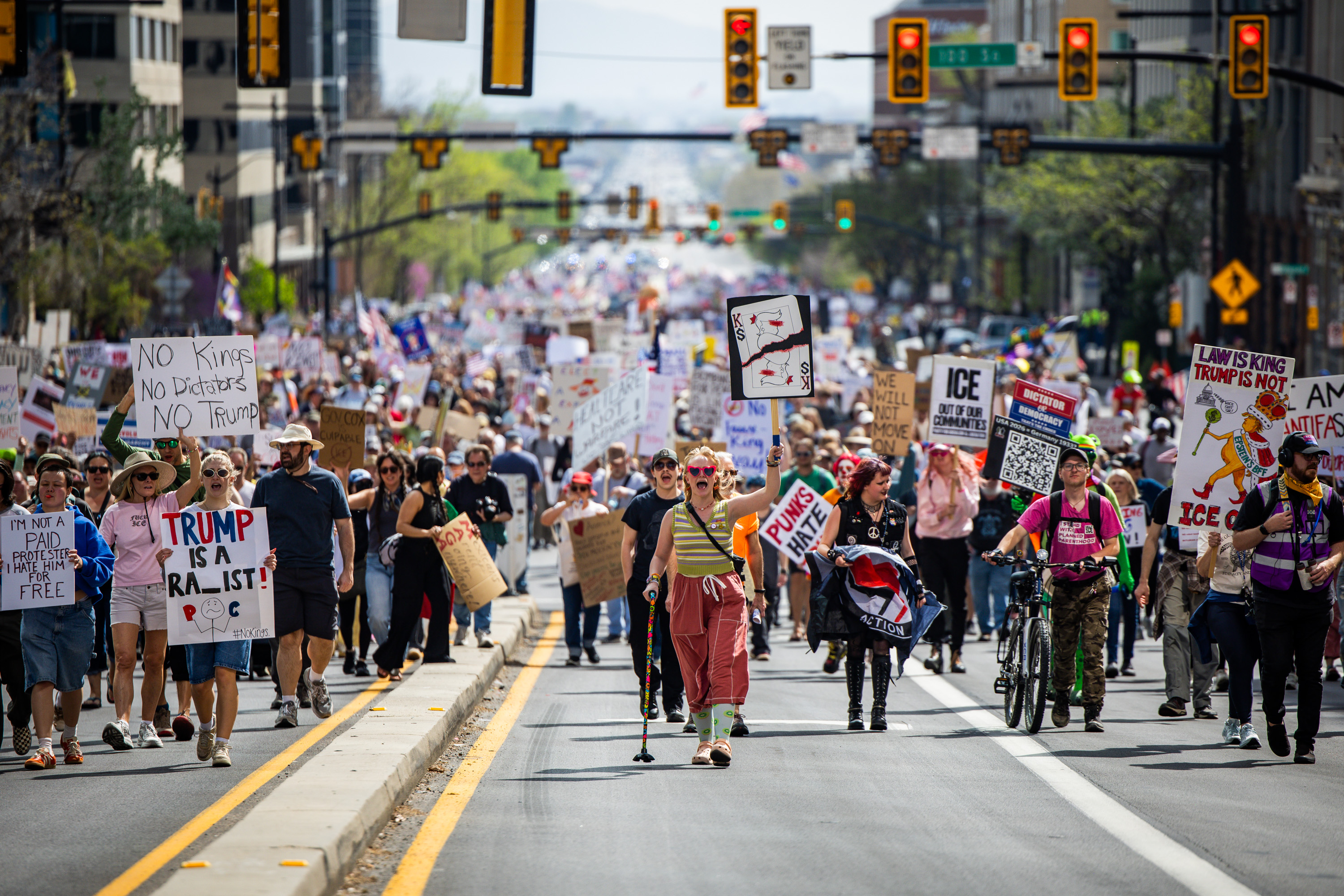 People take part in a “No Kings” anti-Trump protest where they marched from Washington Square Park to the Capitol in Salt Lake City on Saturday. The Utah Highway Patrol said about 8,000 people participated in the rally.