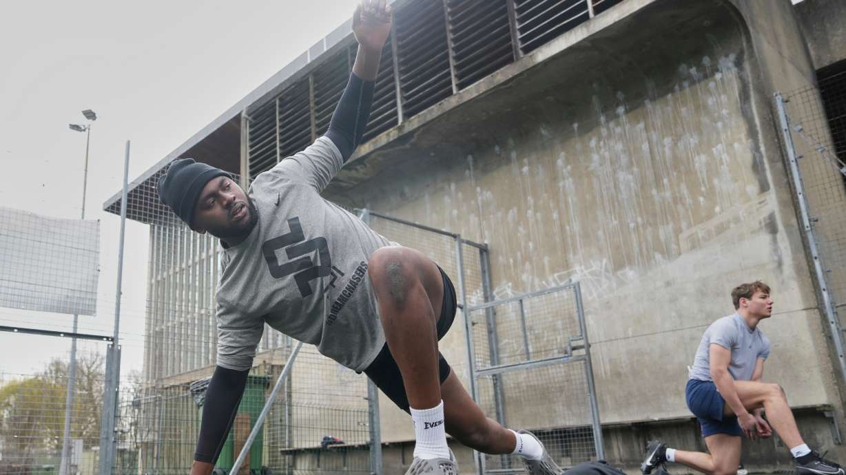 Oluwanifemi 'Neff' Giwa, front, takes part in a football workout session at the National Sports Center, Crystal Palace in London, Sunday, March 29, 2026.