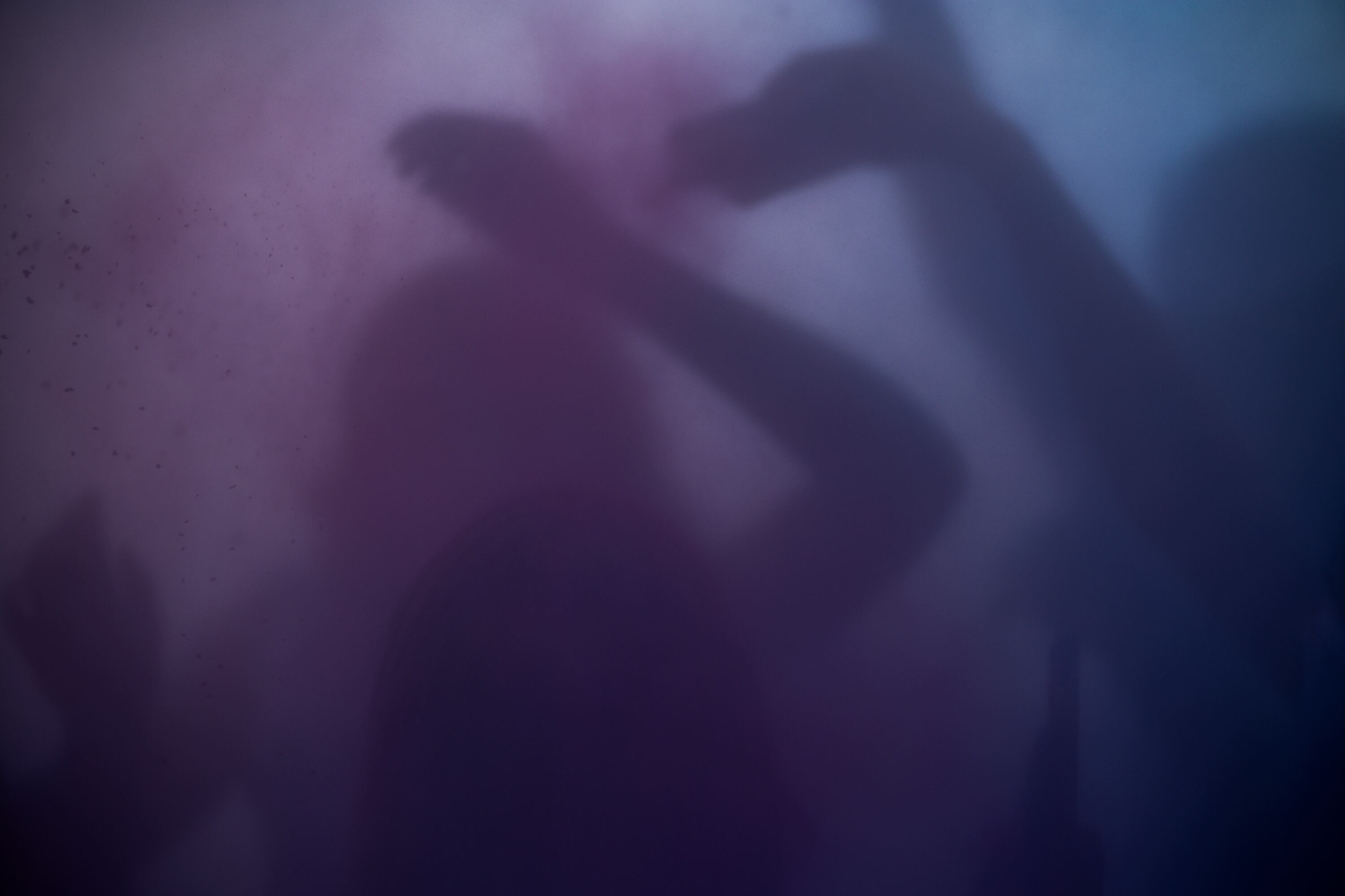 People are obscured by a cloud of colored powder as they participate in a color throw during Holi celebrations at the Sri Sri Radha Krishna Temple in Spanish Fork on Saturday.