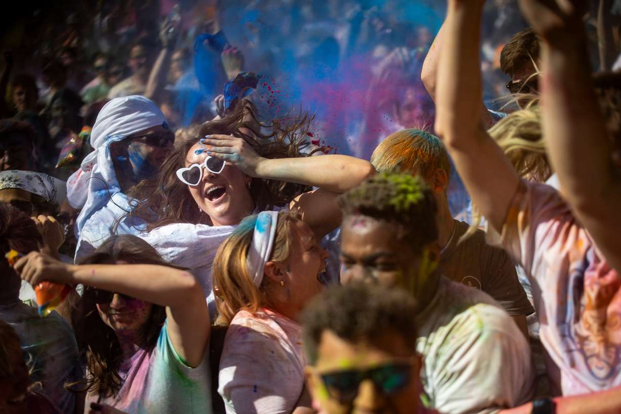 People dance as they celebrate Holi at the Sri Sri Radha Krishna Temple in Spanish Fork on Saturday.