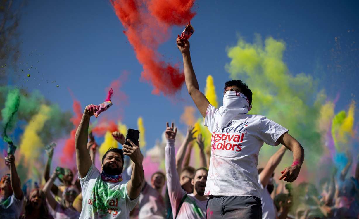 Attendees participate in a color throw as people celebrate Holi at the Sri Sri Radha Krishna Temple in Spanish Fork on Saturday.