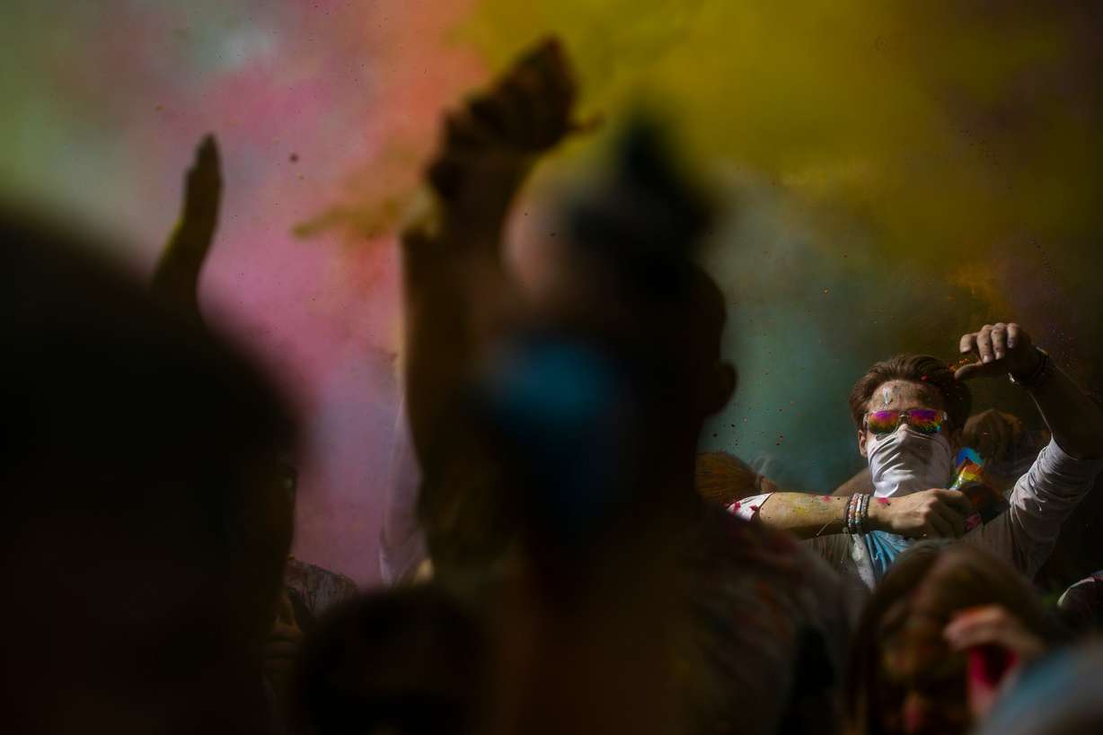 People participate in a color throw as they celebrate Holi at the Sri Sri Radha Krishna Temple in Spanish Fork on Saturday.