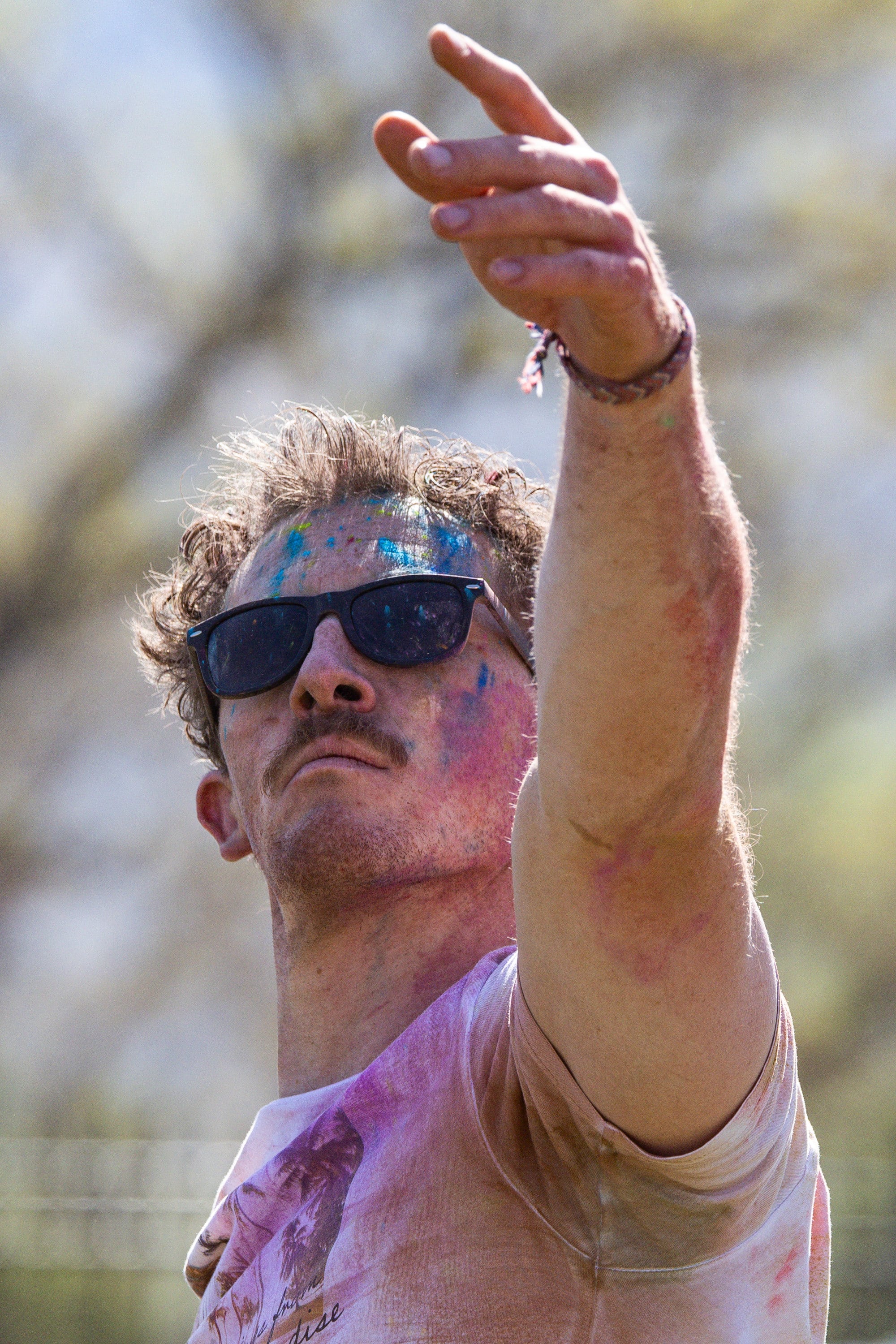 Burke Vance, of Salt Lake City, does yoga as people celebrate Holi at the Sri Sri Radha Krishna Temple in Spanish Fork on Saturday.