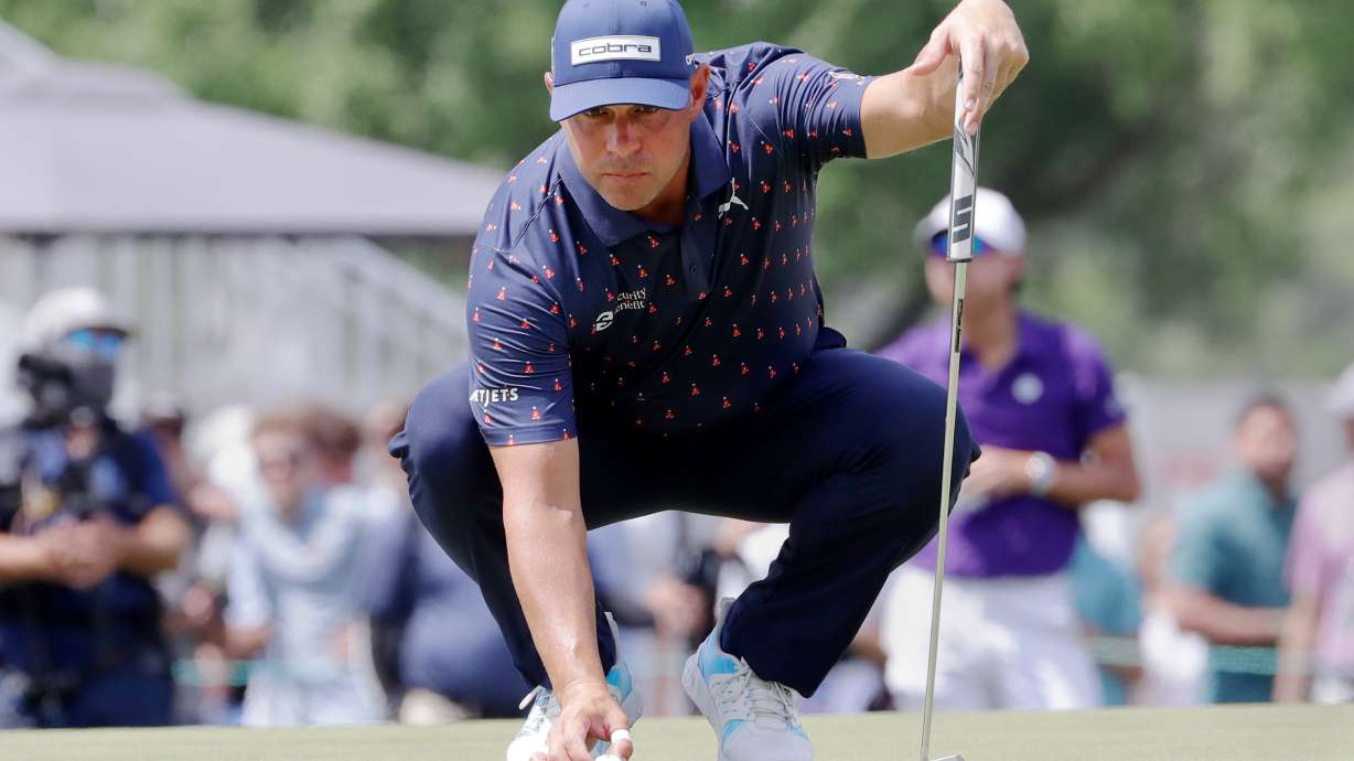 Gary Woodland places his ball on the ninth green during the final round of the Texas Children's Houston Open golf tournament Sunday, March 29, 2026, in Houston.