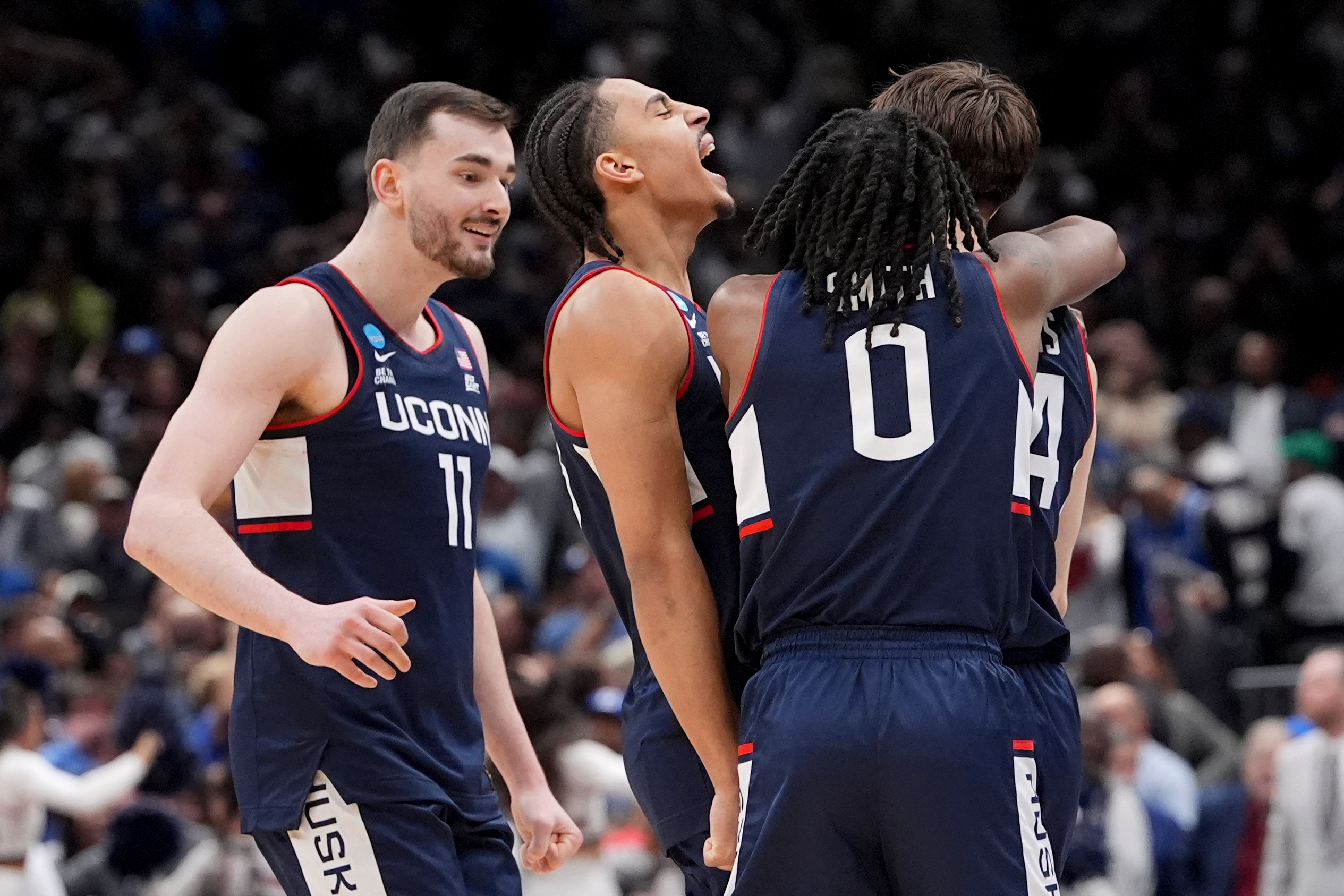 UConn guard Braylon Mullins, right, celebrates his game winning basket with guard Malachi Smith (0) during the second half in the Elite Eight of the NCAA college basketball tournament against Duke, Sunday, March 29, 2026, in Washington. 