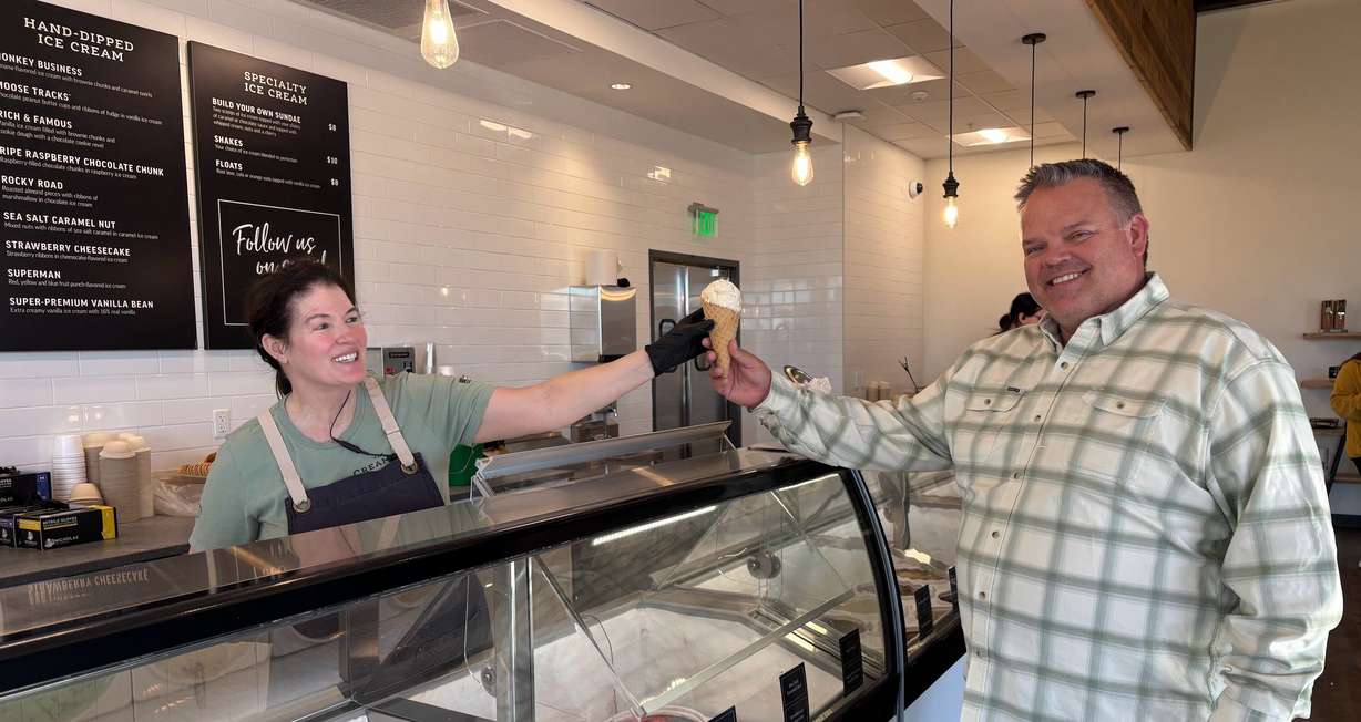 Loraine Mitchell serves an ice cream cone to Matt Robinson, general manager of The Creamery in Beaver. The business is continuing to push the boundaries with a special small town feel.