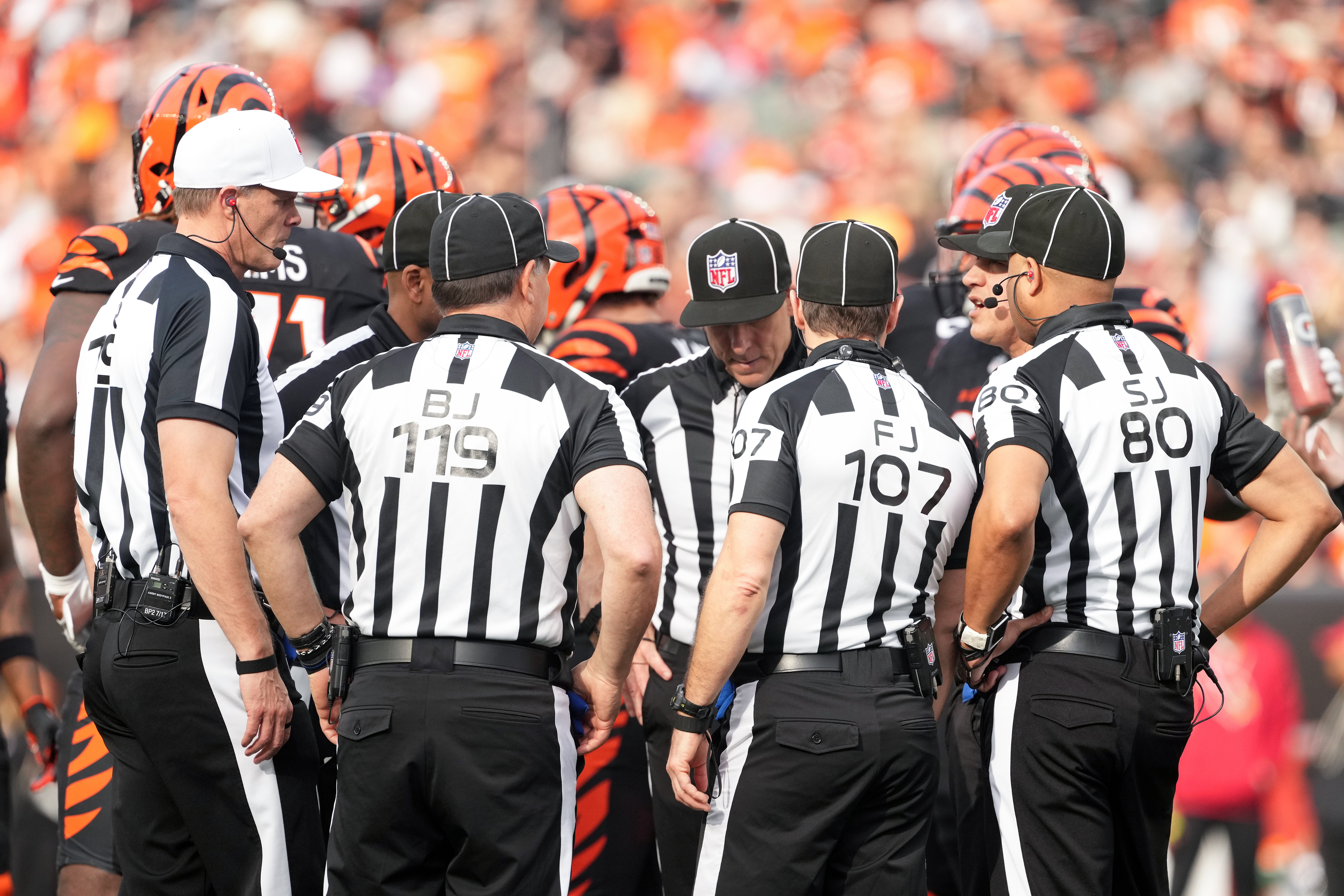 FILE - Referee Clay Martin (19), far left, talks with the officiating crew during an NFL football game between the Arizona Cardinals and the Cincinnati Bengals, Sunday, Dec. 28, 2025, in Cincinnati. 