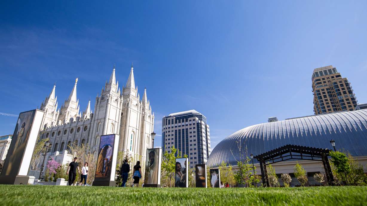 People walk past part of the Easter display at Temple Square in Salt Lake City on March 29. The April general conference of The Church of Jesus Christ of Latter-day Saints begins Saturday.