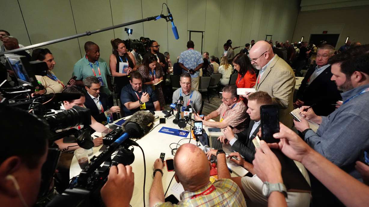 New York Giants head coach John Harbaugh talks with reporters at the annual NFL football meetings, Monday, March 30, 2026, in Phoenix.