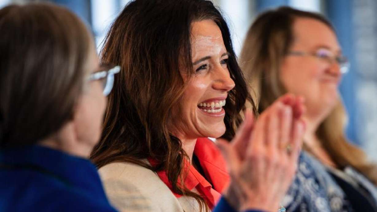 Brandi Webster, principal of Mona Elementary, center, smiles as Sen. Ann Millner, R-Ogden, left, claps for her during a Literacy and Reading Symposium hosted by Gov. Spencer Cox and first lady Abby Cox at The Monarch in Ogden on Jan. 6.