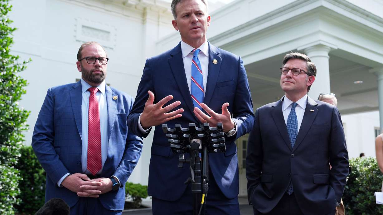 Rep. Blake Moore, R-Utah, speaks with members of the media as Rep. Jason Smith and House Speaker Mike Johnson, R-La., listen outside the White House, June 9, 2025, in Washington.