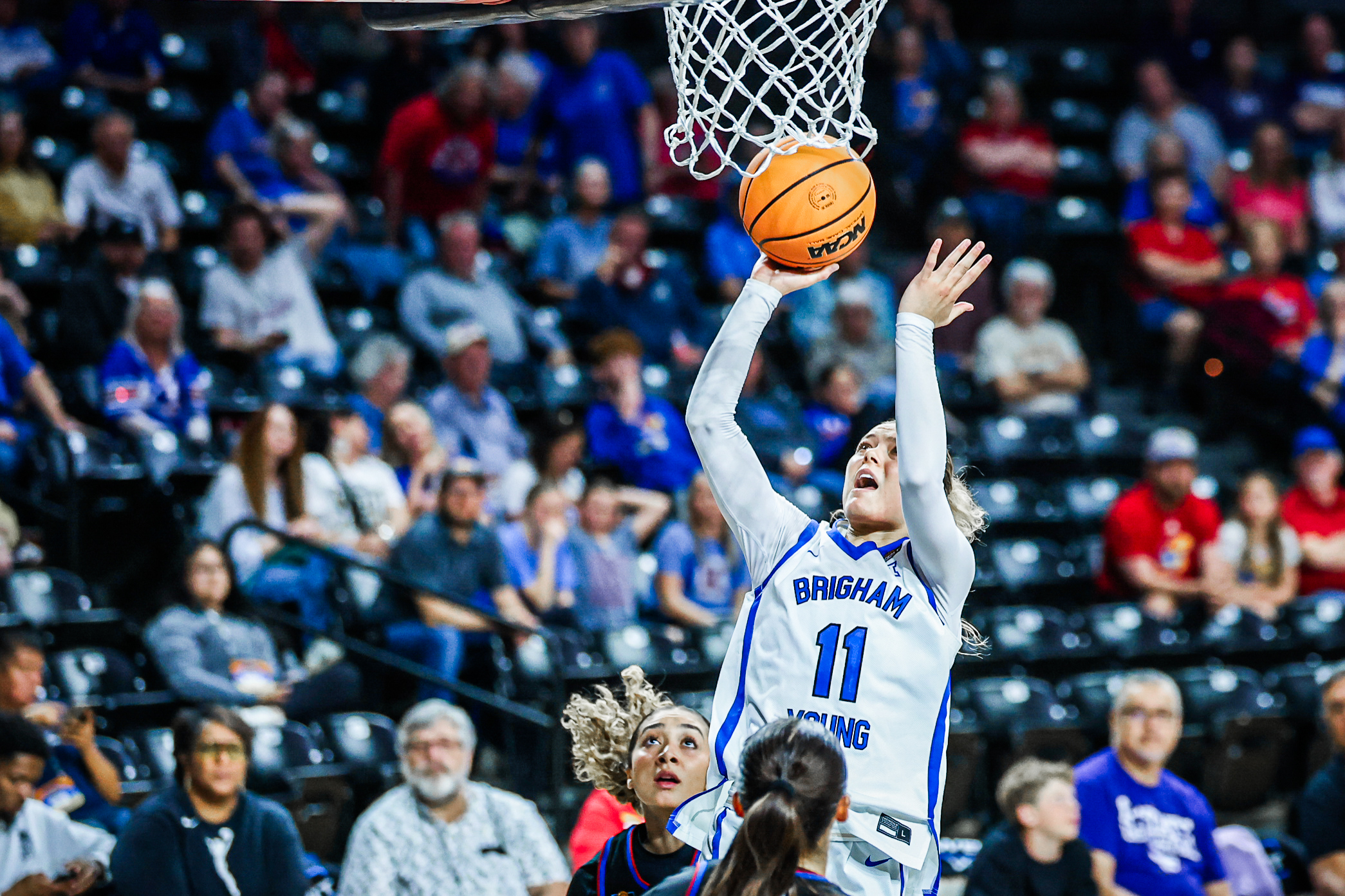 BYU guard Delaney Gibb (11) puts up a shot during a WBIT semifinal game against Kansas, Monday, March 30, 2026 in Wichita, Kansas.