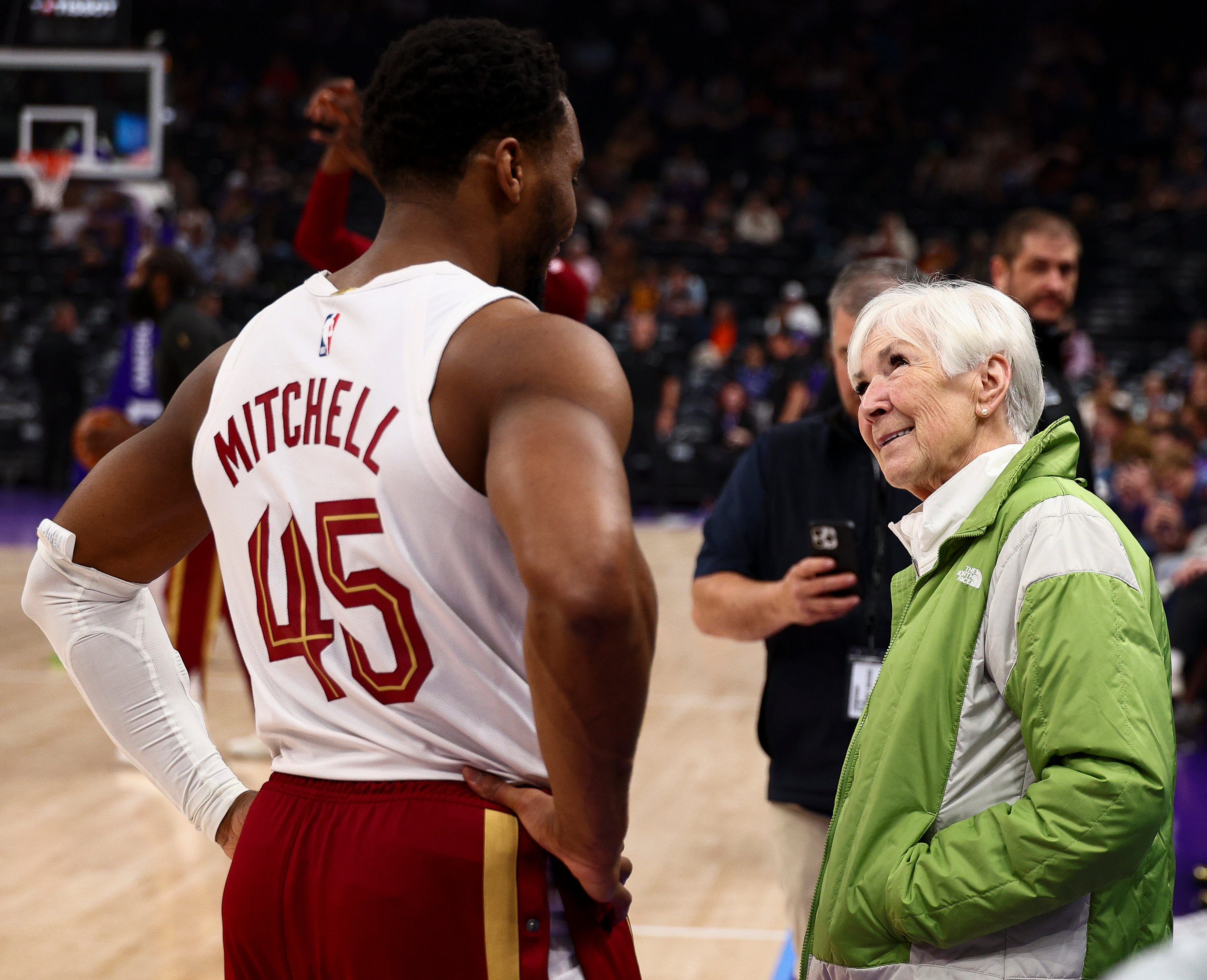 Cleveland Cavaliers guard Donovan Mitchell (45) talks with Gail Miller before an NBA game against the Utah Jazz at the Delta Center in Salt Lake City on Monday, March 30, 2026.