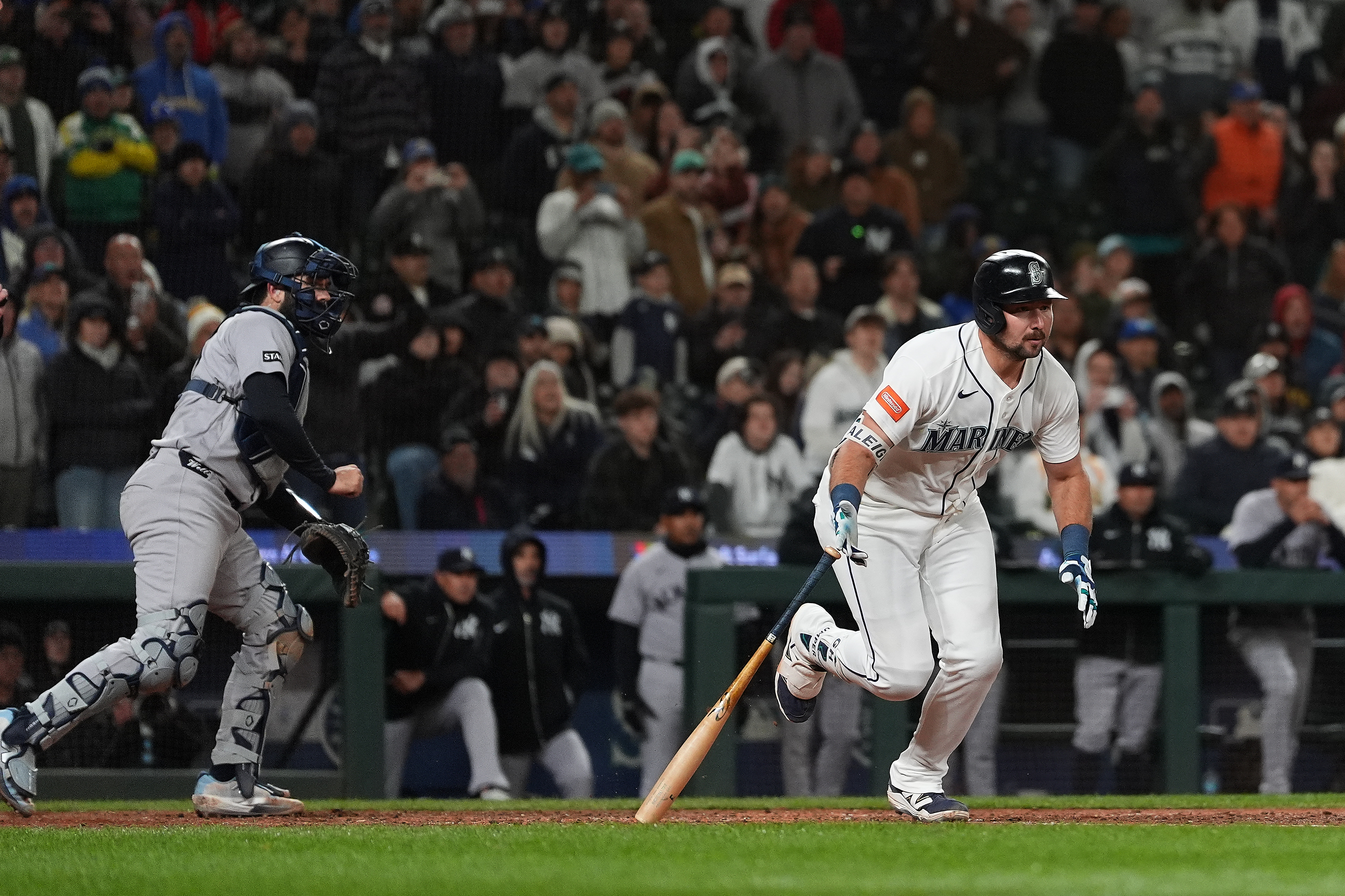 Seattle Mariners' Cal Raleigh hits a game-winning single during the ninth inning of a baseball game against the New York Yankees, Monday, March 30, 2026, in Seattle. 