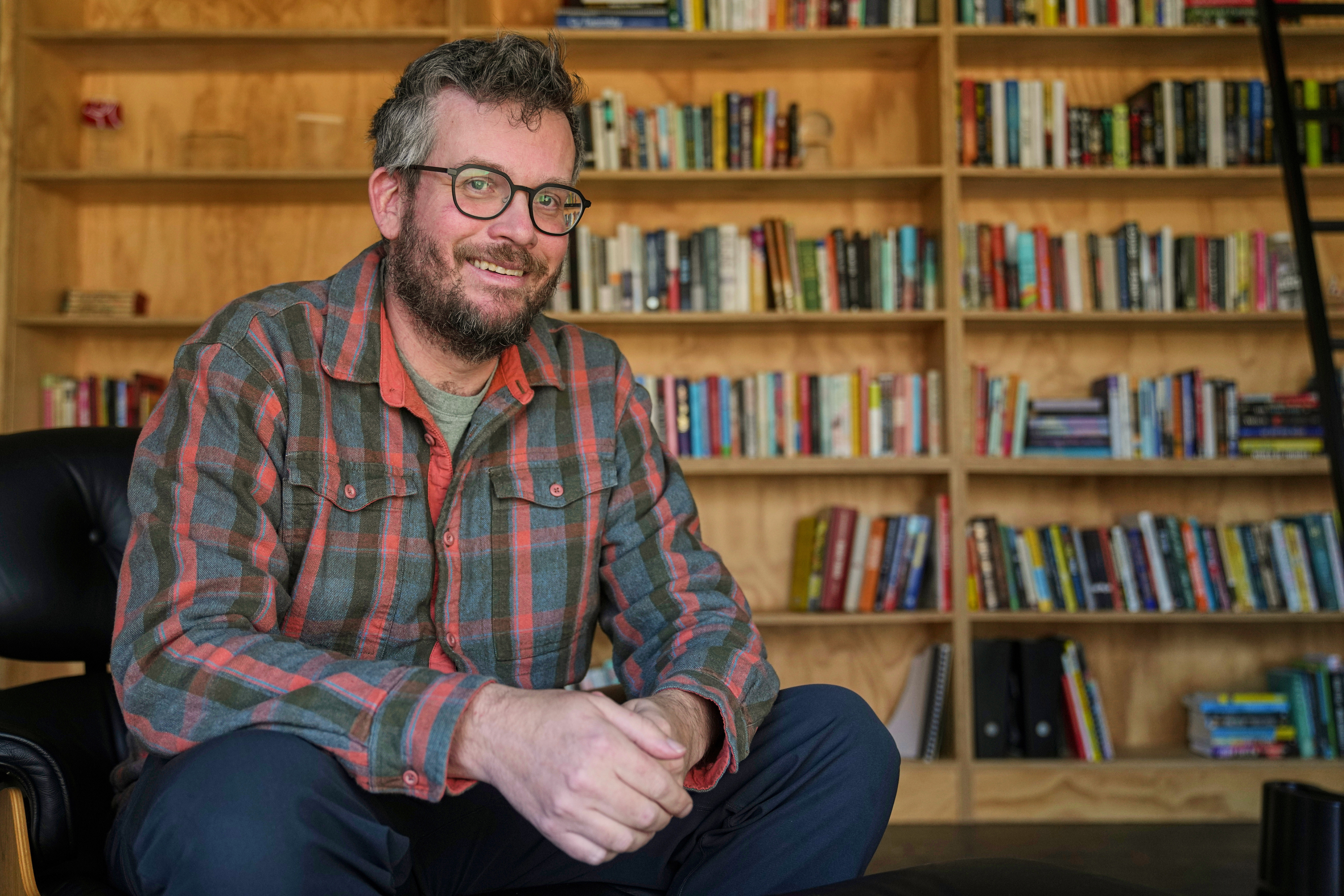 Author John Green poses in his studio in Indianapolis on Jan. 21. Green will be in Utah for his book tour this fall.