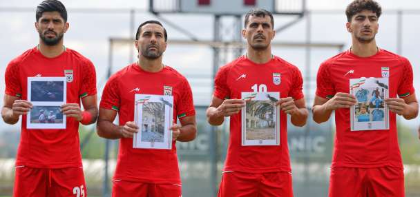 Iran soccer players meet FIFA head Infantino before World Cup warmup and honor child victims of war