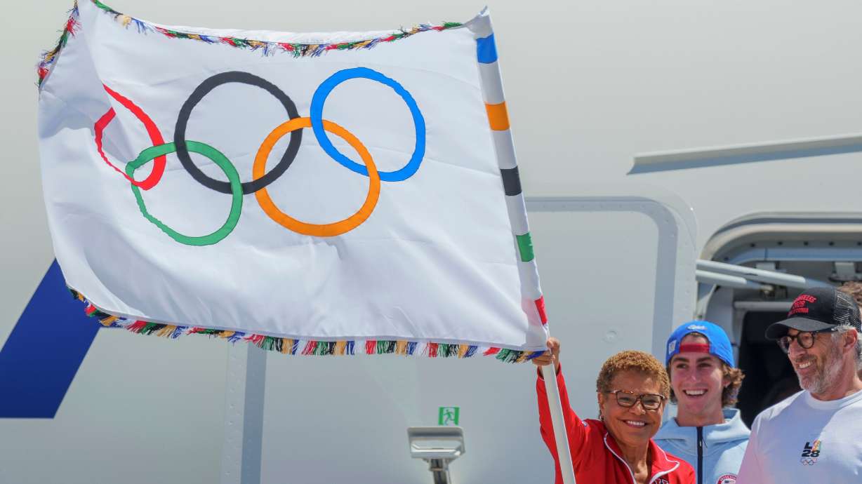 Los Angeles Mayor Karen Bass, LA28 Chairman Casey Wasserman and Team USA Oympian skateboarder Tate Carew at Los Angeles International Airport on Aug. 12, 2024. Tickets go on sale for the Games this week, but not for everyone.