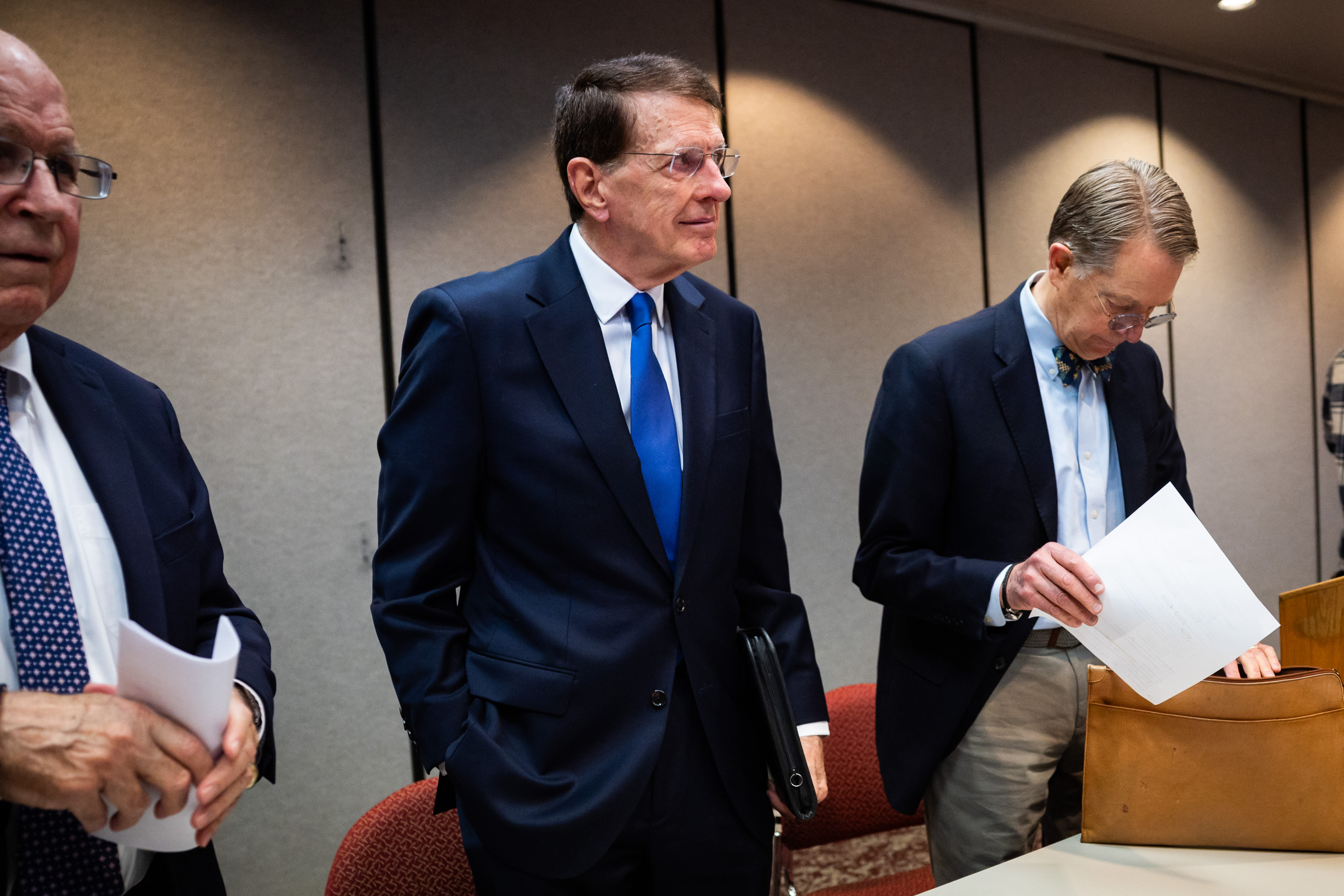 Richard Lambert, Brent Ward and Jim McConkie, from left, of the law firm of Parker and McConkie stand up after speaking about the firm’s decision to file a notice of intent to sue the U.S. government in federal court to recover $56 million in damages for personal injuries to their client, a Venezuelan young man who was detained by ICE and deported to an El Salvadoran prison known as CECOT, at the Utah State Bar in Salt Lake City on Tuesday.