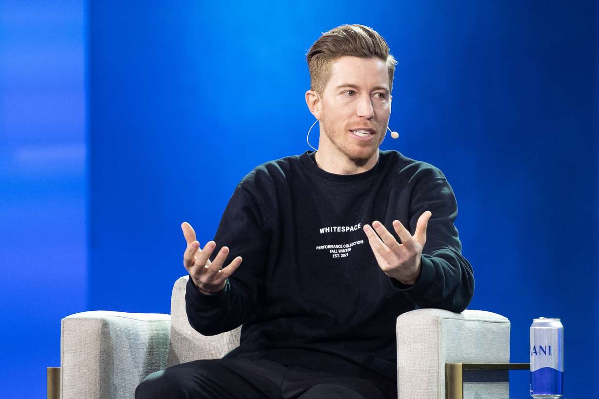 Shaun White, former Olympian, speaks with Ryan Smith, (not pictured) co-founder of Qualtrics and owner of the Utah Jazz, during Day 2 of the Qualtrics X4: The Experience Management Summit at the Salt Palace in Salt Lake City on March 9, 2023.