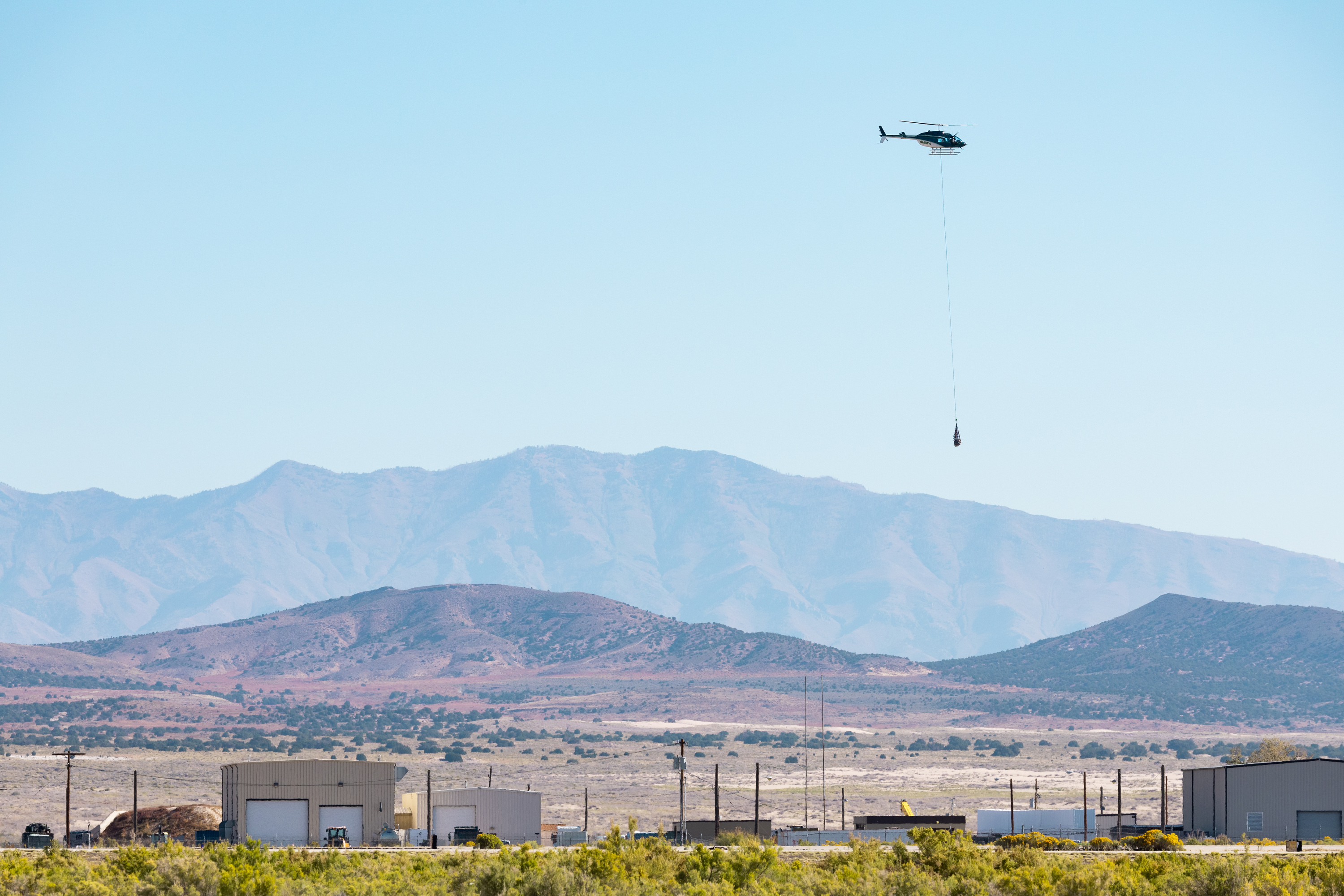 A helicopter flys over the U.S. Army’s Dugway Proving Ground in Dugway on Sept. 24, 2023. The Army on Monday announced Dugway has been conditionally selected as one of two military installations to potentially host new data center projects.