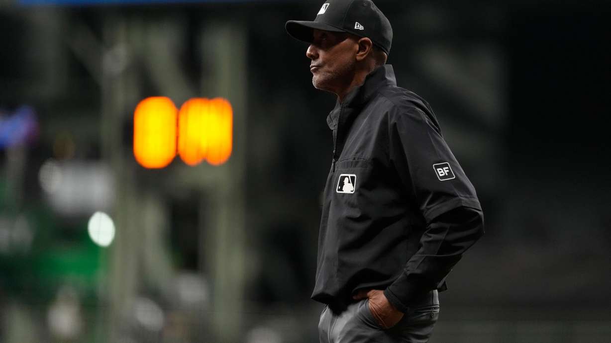 Umpire CB Bucknor looks on during the eighth inning of a baseball game between the Milwaukee Brewers and the Tampa Bay Rays, Tuesday, March 31, 2026, in Milwaukee.