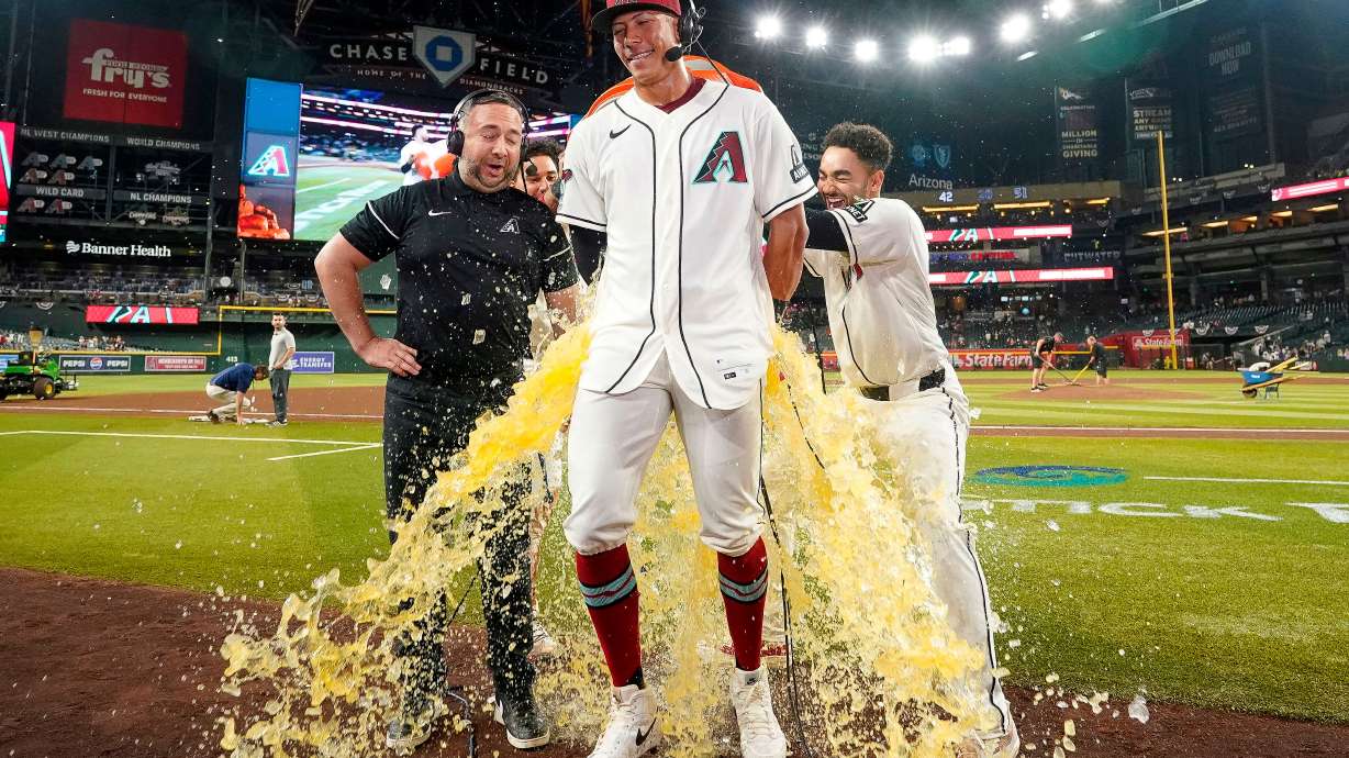 Arizona Diamondbacks' Jose Fernandez gets a gatorade bath after hitting two home runs and four RBI's in his first major league baseball game against the Detroit Tigers Tuesday, March 31, 2026, in Phoenix.