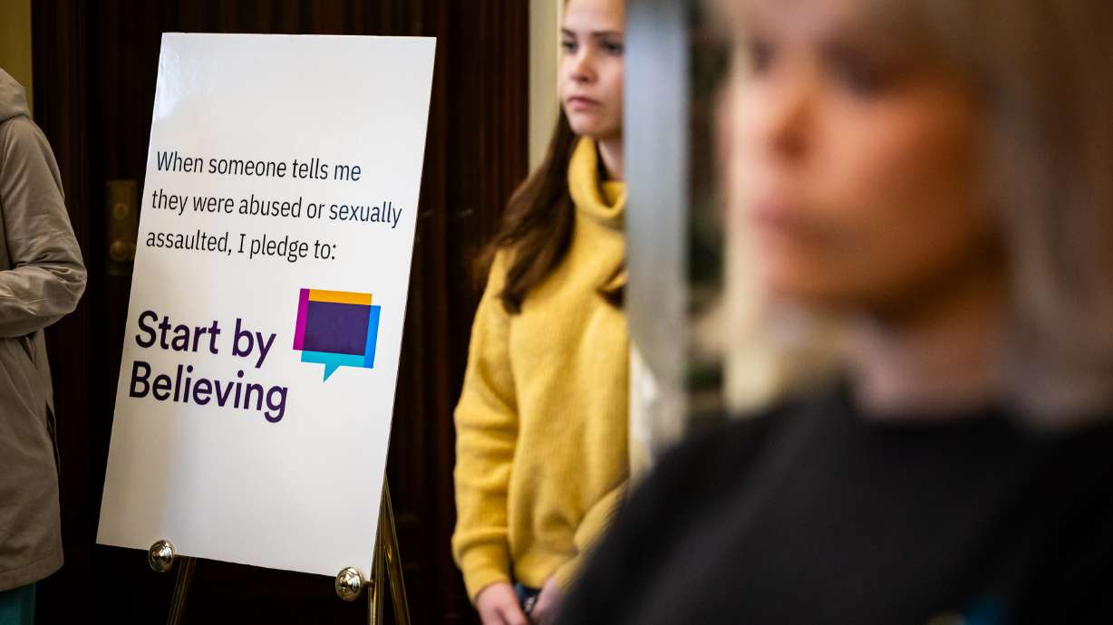 People listen to speakers at an event to kick off National Sexual Assault Awareness and Prevention Month on National Start by Believing Day at the Capitol in Salt Lake City on Wednesday.