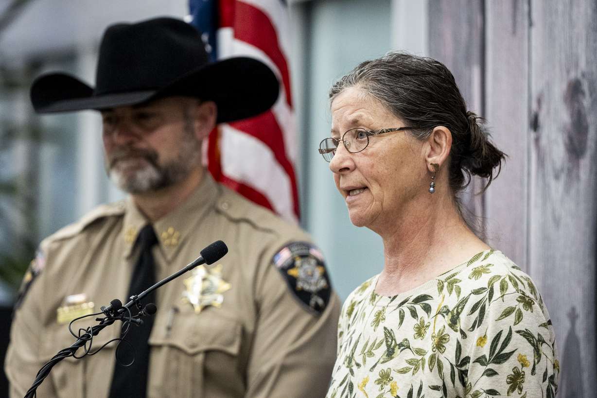 Michelle Impala, younger sister of Laura Aime, speaks while joined by Utah County Sheriff Mike Smith during a press conference announcing definitive evidence has been found that Ted Bundy murdered Laura Ann Aime in 1974, held at the Utah County Sheriff's Office in Spanish Fork on Wednesday.