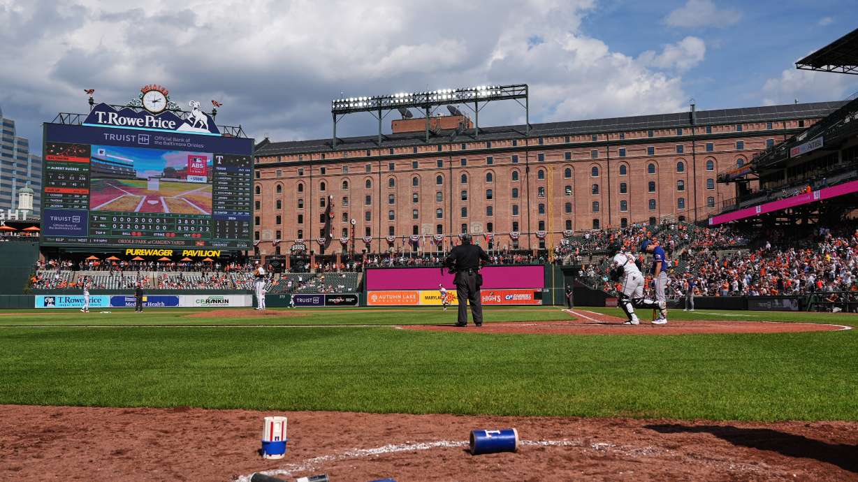 A called ball is overturned through the Automated Ball-Strike system, resulting in a win for the Baltimore Orioles over the Texas Rangers in the ninth inning of a baseball game, Wednesday, April 1, 2026, in Baltimore.