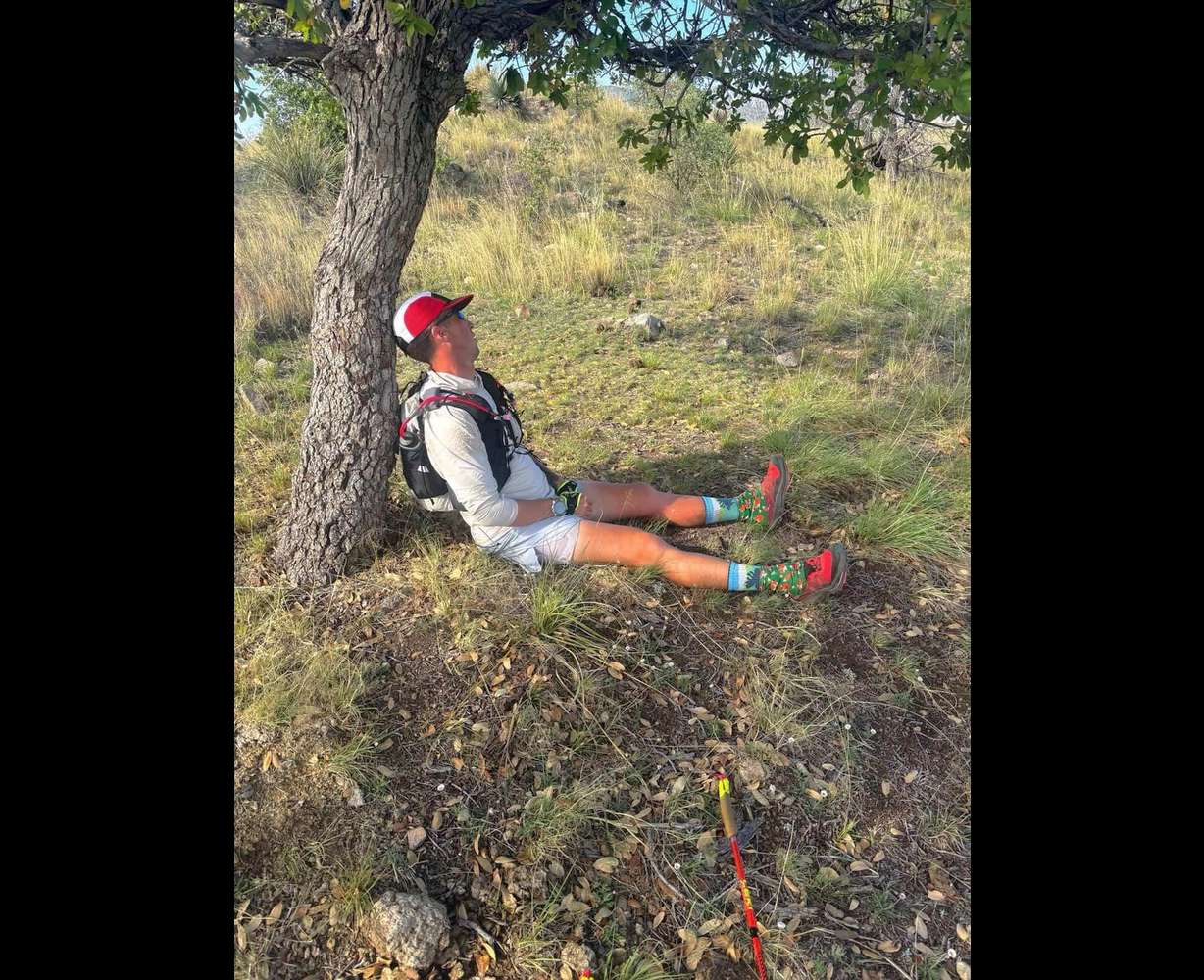 Michael McKnight rests against a tree during a brief nap while doing the Arizona Monster 300. Utah native Michael McKnight overcame mental and physical hurdles to break the record for the Arizona Monster 300, a 304-mile race through the Sonoran Desert.