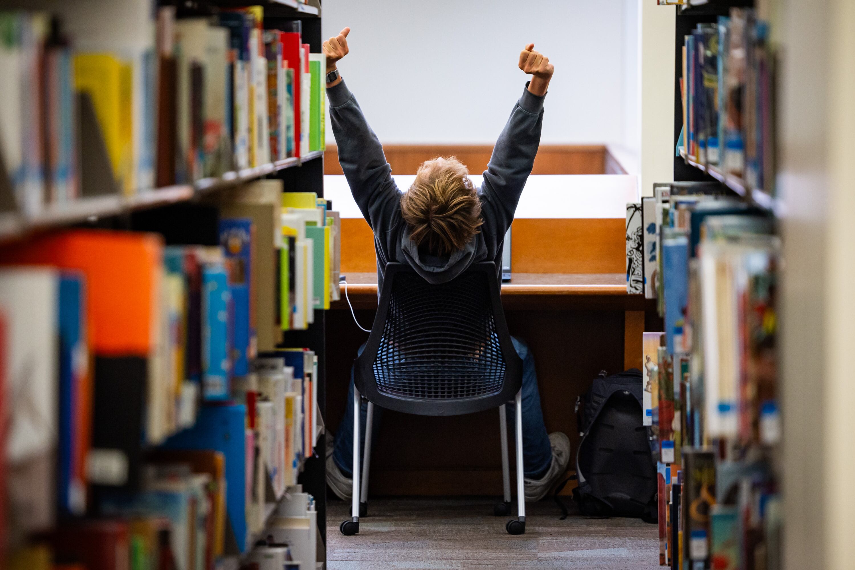 University of Utah student Riley Richmond, 21, stretches in between working on his computer at the J. Willard Marriott Library  in Salt Lake City on Wednesday.