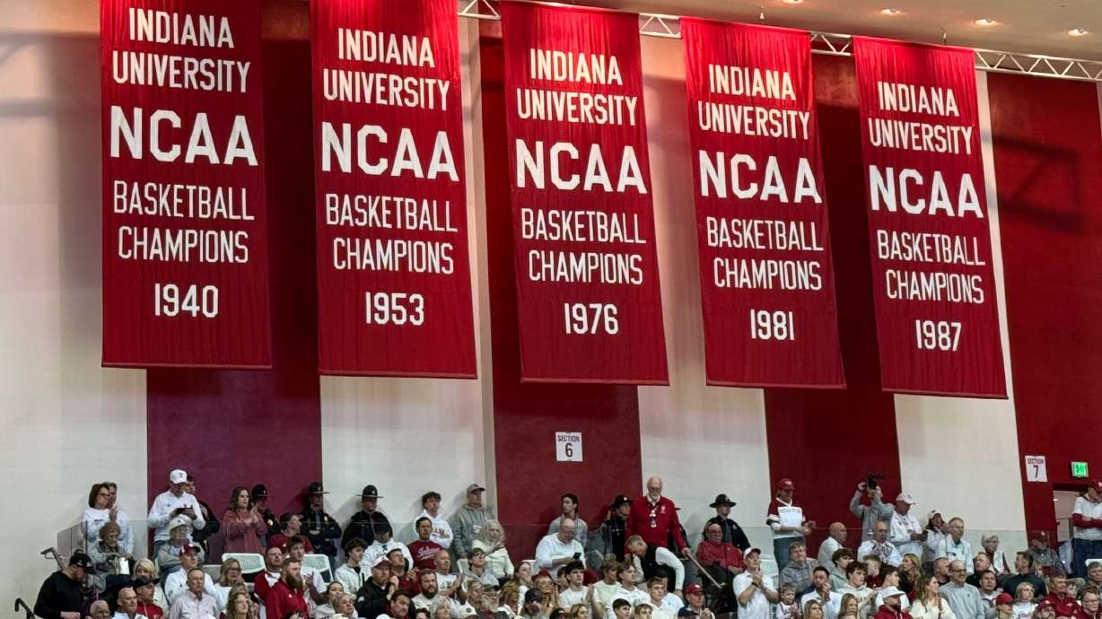 Championship banners, including the Indiana Hoosiers 1975-76 national championship team, the last undefeated men's Division I team to win the championship, hang in the arena before a basketball game against Michigan State, March 1, 2026, in Bloomington, Ind.