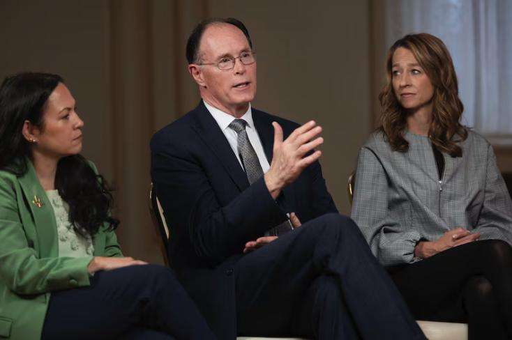 Bishop W. Christopher Waddell, presiding bishop of The Church of Jesus Christ of Latter-day Saints, speaks at Pamela Atkinson’s humanitarian roundtable at the Thomas S. Monson Center in Salt Lake City on Wednesday. Sophia M. DiCaro, left, and Utah first lady Abby Cox listen.