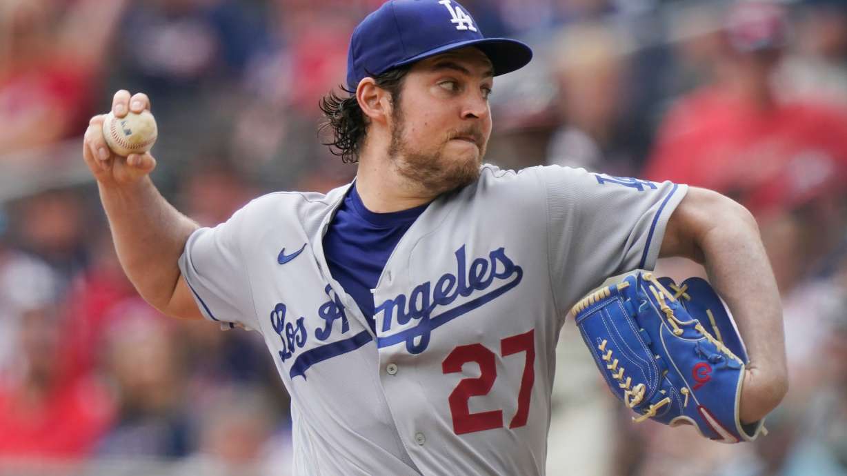 FILE - Los Angeles Dodgers starting pitcher Trevor Bauer (27) delivers in the first inning of a baseball game against the Atlanta Braves Sunday, June 6, 2021, in Atlanta.