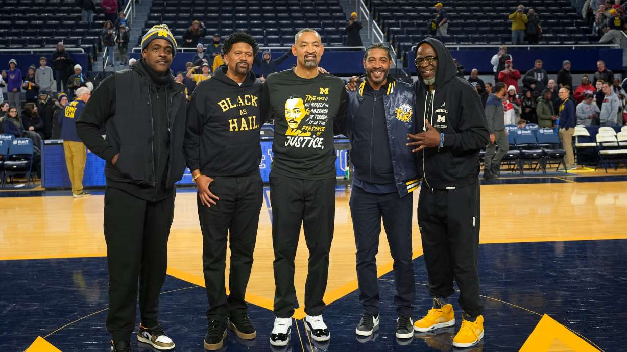 FILE - Former Michigan Fab Five basketball players Chris Webber, from left, Jalen Rose, Michigan head coach Juwan Howard, Jimmy King and Ray Jackson pose pose after an NCAA college basketball game against Ohio State in Ann Arbor, Mich., Monday, Jan. 15, 2024.