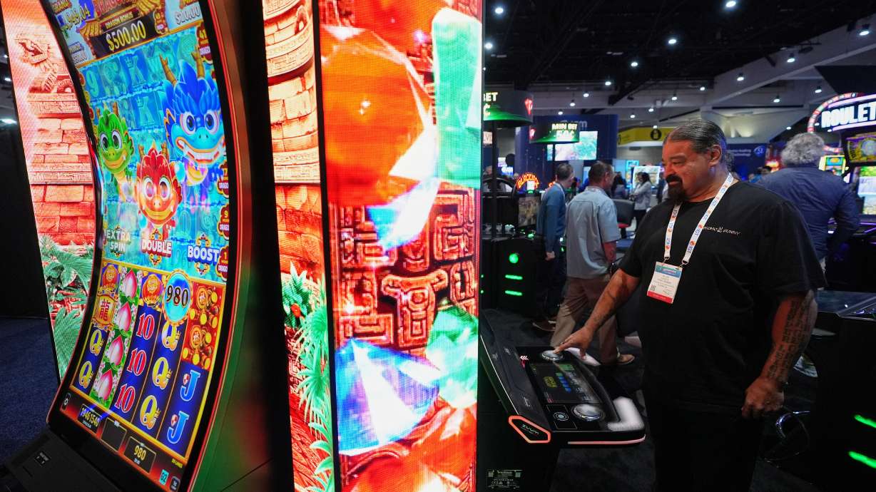 William Tucker Jr, a council member of the Sycuan Band of the Kumeyaay Nation from El Cajon, Calif., checks out a display at the Indian Gaming Association's annual convention in San Diego, Thursday, April 2, 2026.